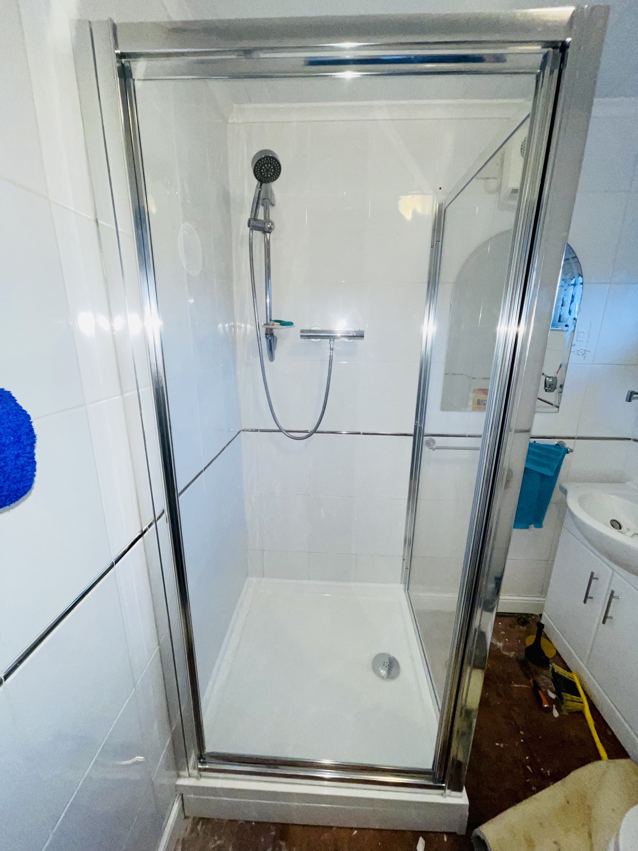 New shower enclosure fitted with fresh white tiling